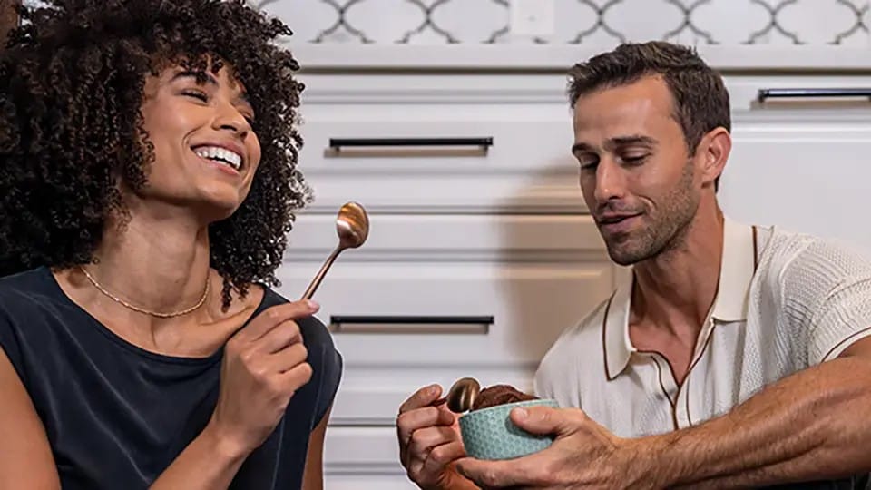 Man and woman enjoying Proof Hard Ice Cream